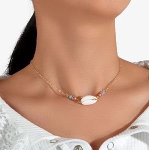 Pacific coast cowrie shell necklace gold blue pink